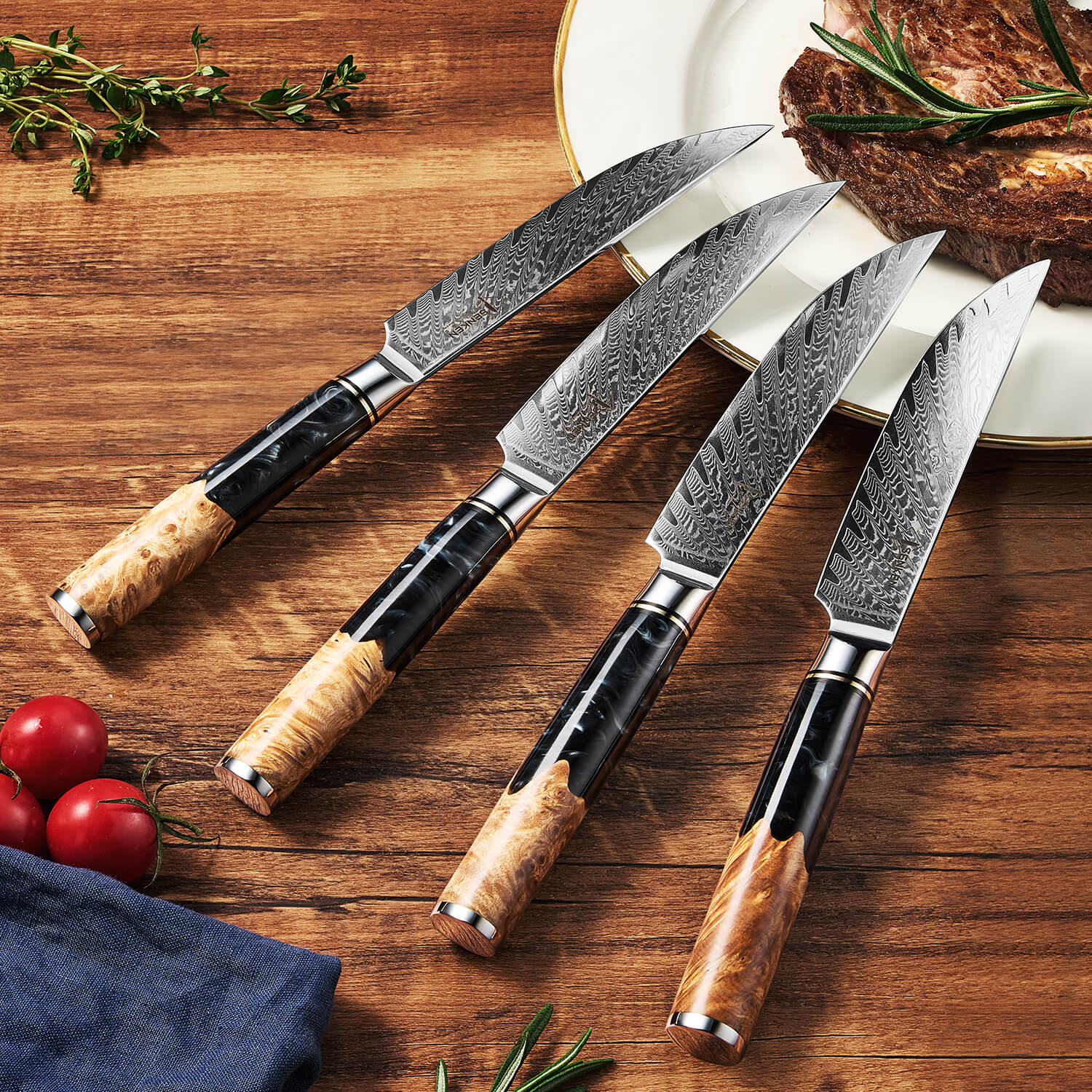 Set of four Damascus steel knives with wooden handles on a wooden surface with food items.