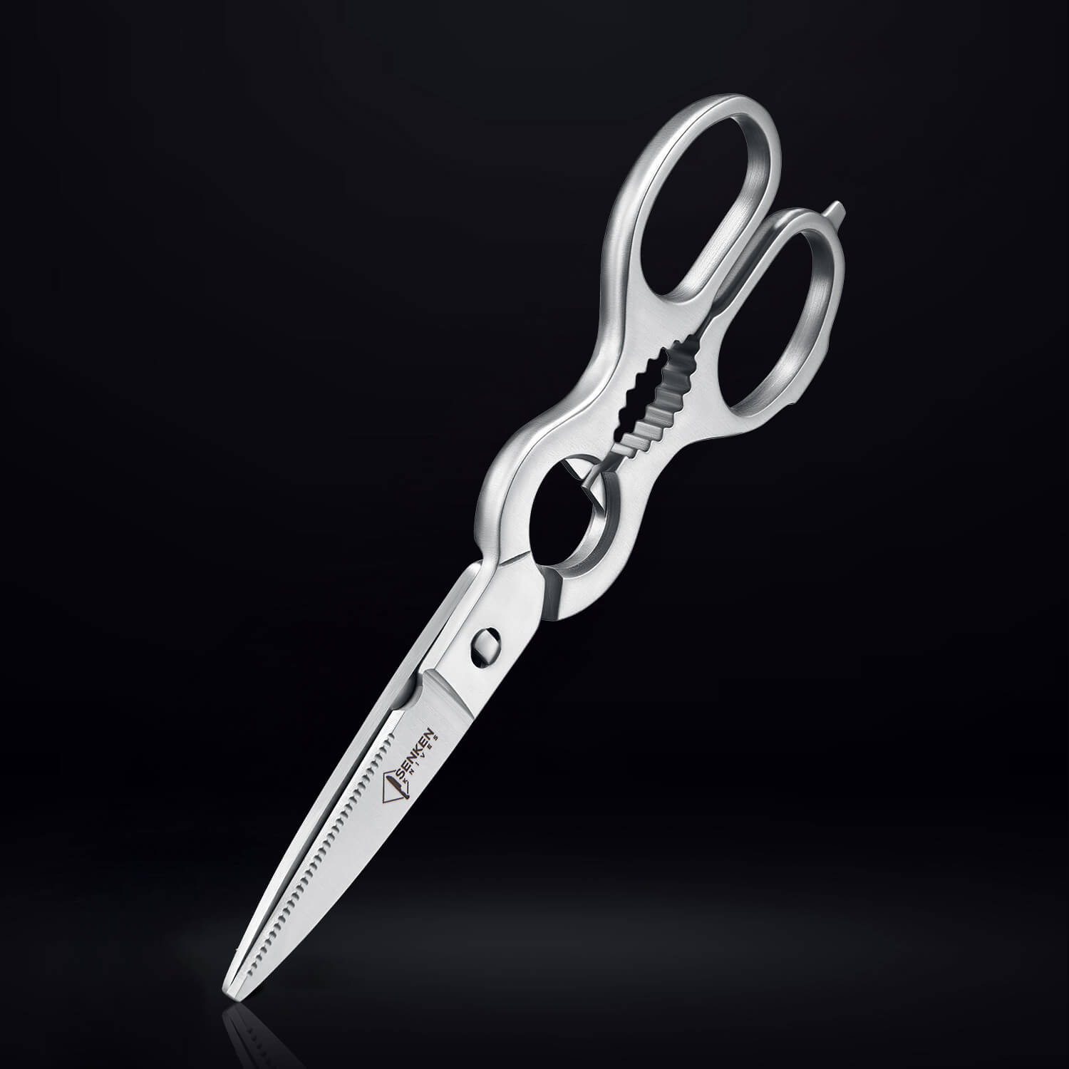 Senken stainless steel kitchen shears with serrated blades and built-in bottle opener on a dark background.