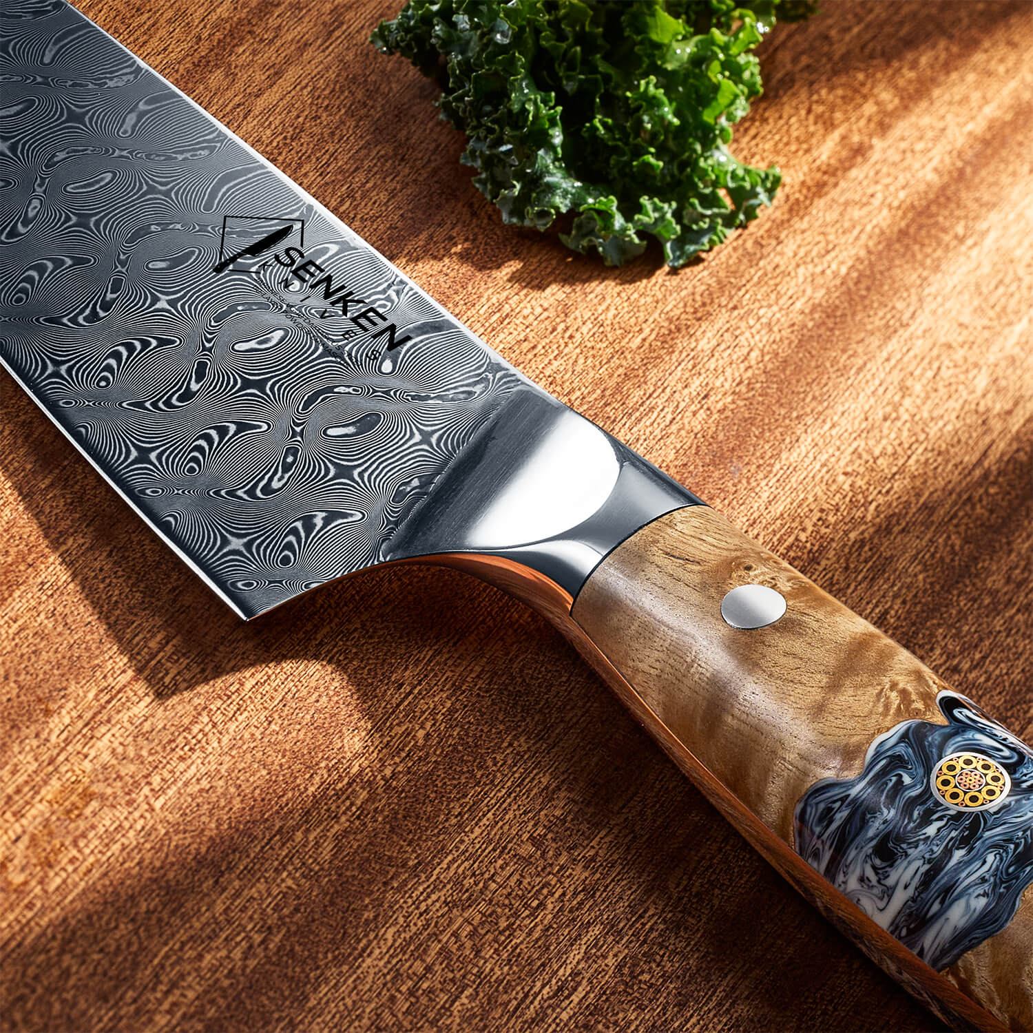 Senken Logo Closeup on Tenjin 110 Layer Damascus Steel Japanese Chef Knife with Wood Resin Handle