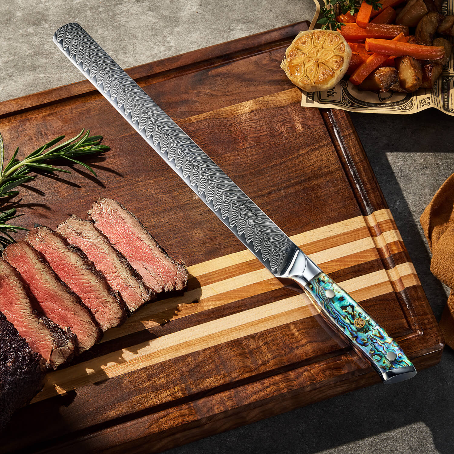 Decorative knife with a Damascus pattern on a wooden cutting board with sliced steak and vegetables.