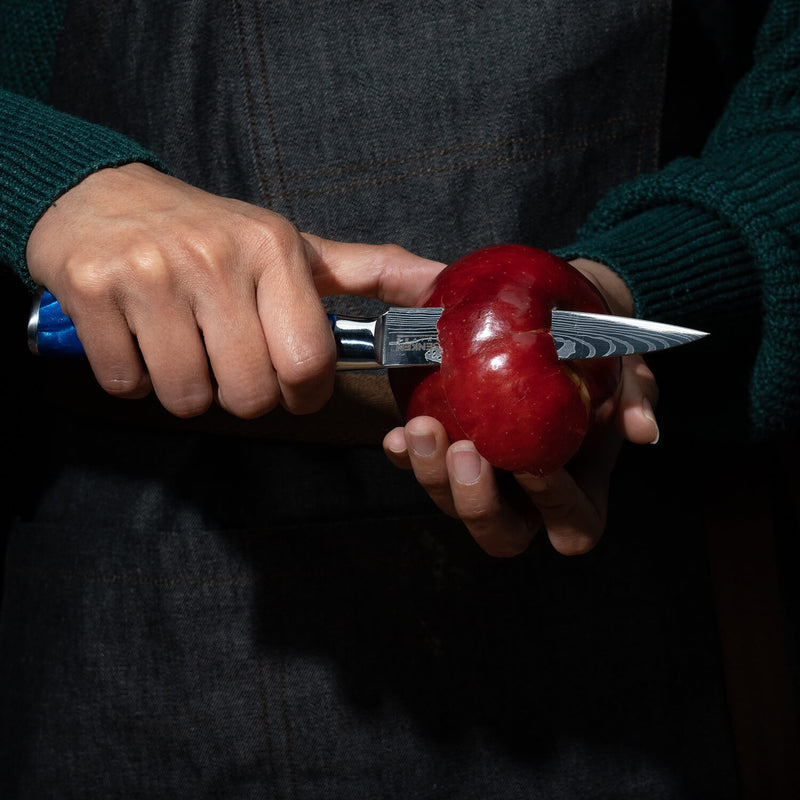 Cerulean Blue Resin Paring Knife by Senken Knives Peeling Apple