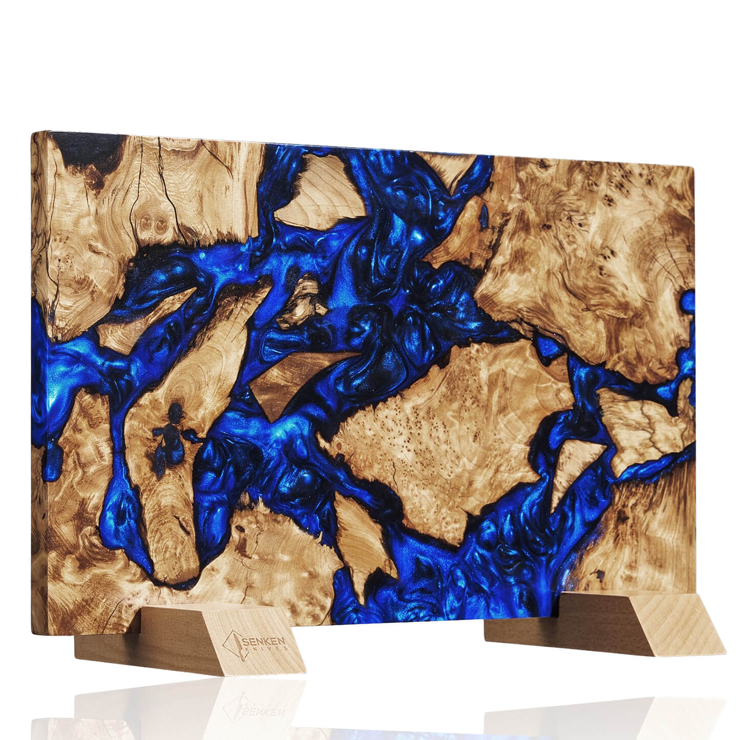 Wooden knife blockwith blue resin inlay on a white background