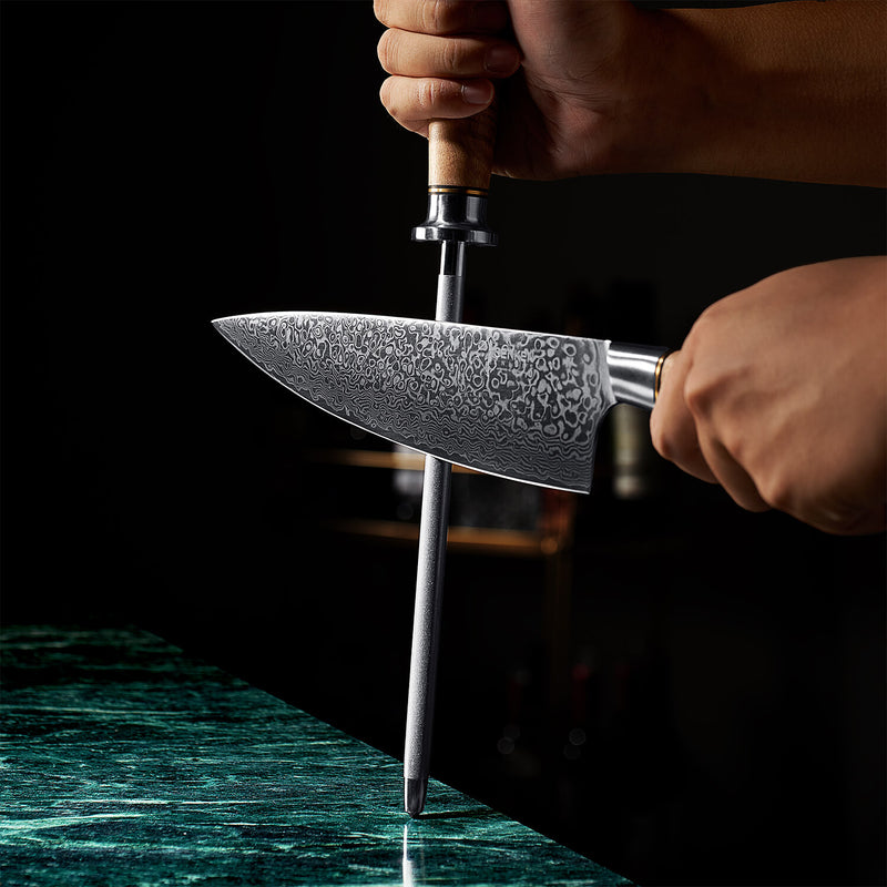 Dynasty Damascus Chef Knife being sharpened by diamond grain sharpening rod