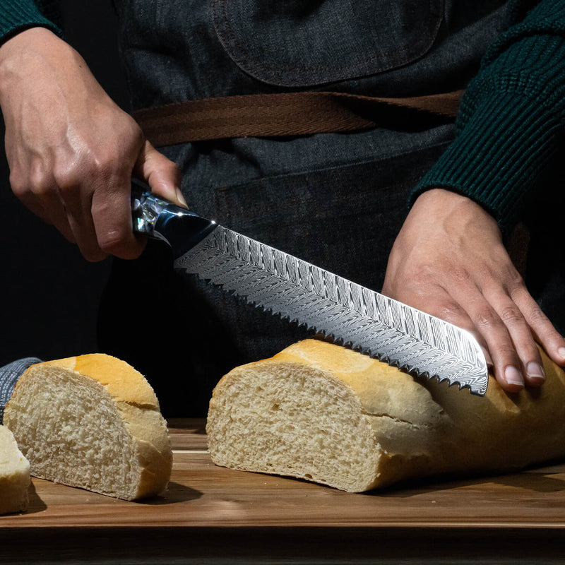 Umi Damascus Japanese Steel Bread Knife Cutting through Loaf